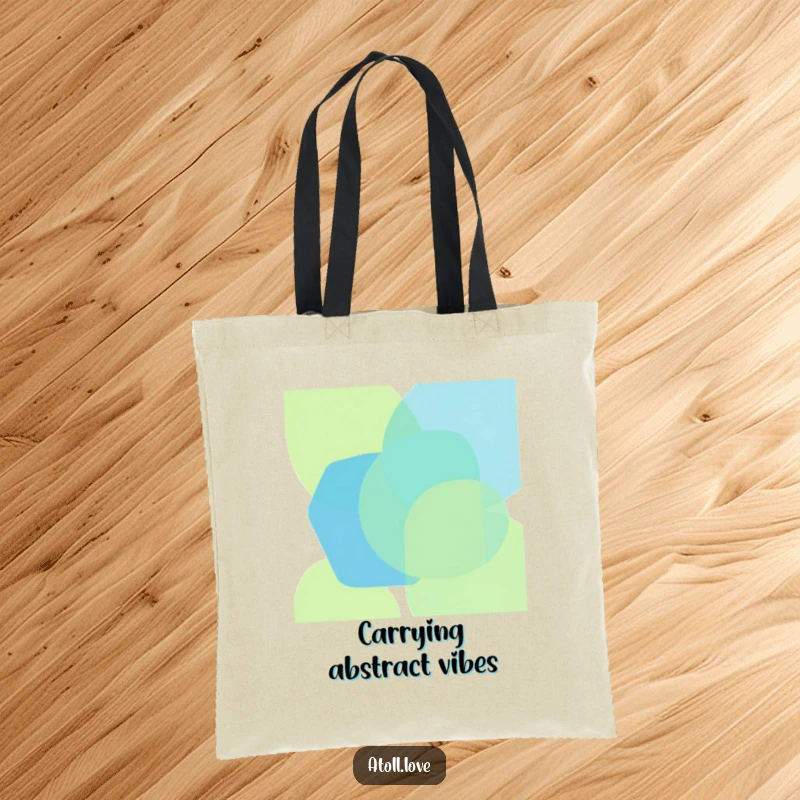 Funny tote bag with bold, overlapping geometric shapes in oceanic blues and greens, showcasing abstract ocean art, a great funny gift.